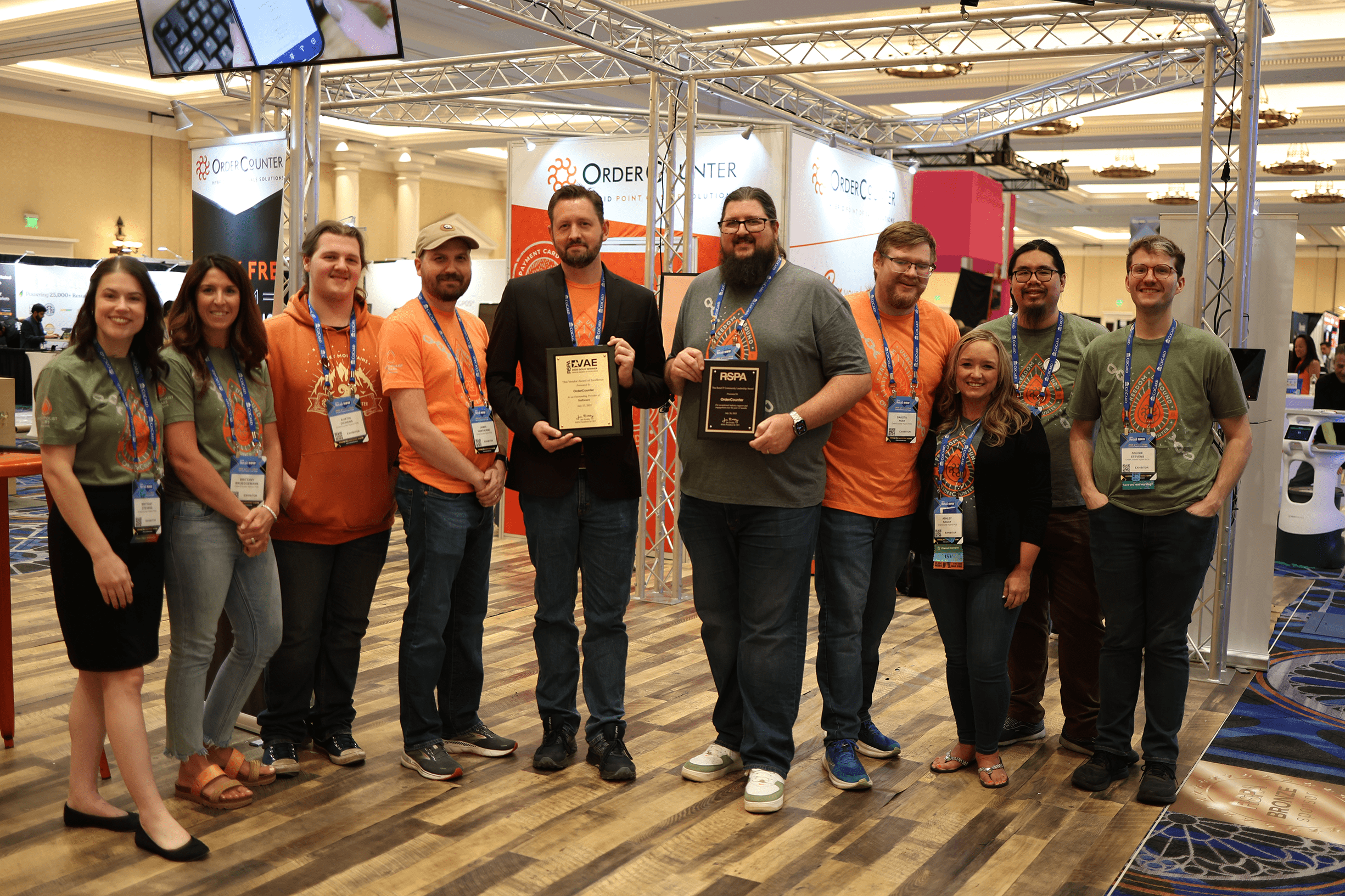 OrderCounter team on stage accepting the 2025 Vendor Award of Excellence – Gold and the Retail IT Community Leadership Award at RetailNOW 2025.